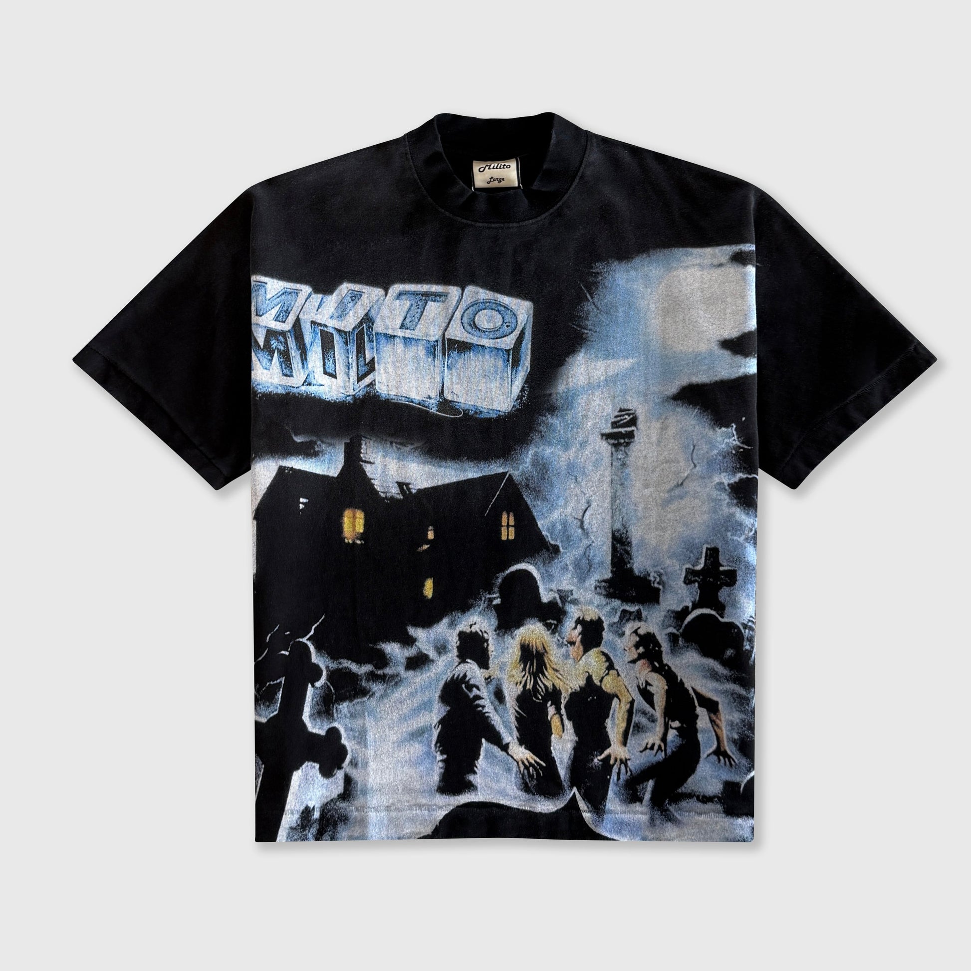 A black short-sleeve graphic t-shirt featuring a large, detailed black and white print on the front depicting a snowy night scene with a house, figures, and a large sign reading 'MYTH'.